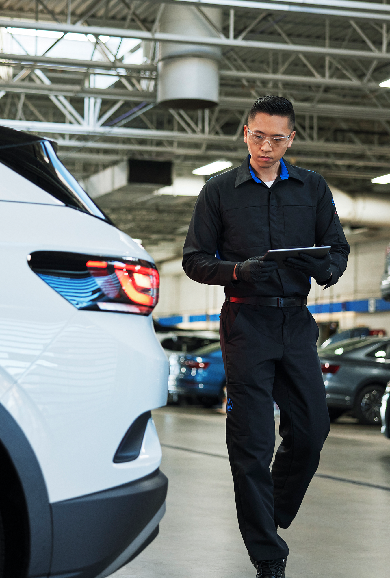 Volkswagen service specialist discussing vehicle maintenance